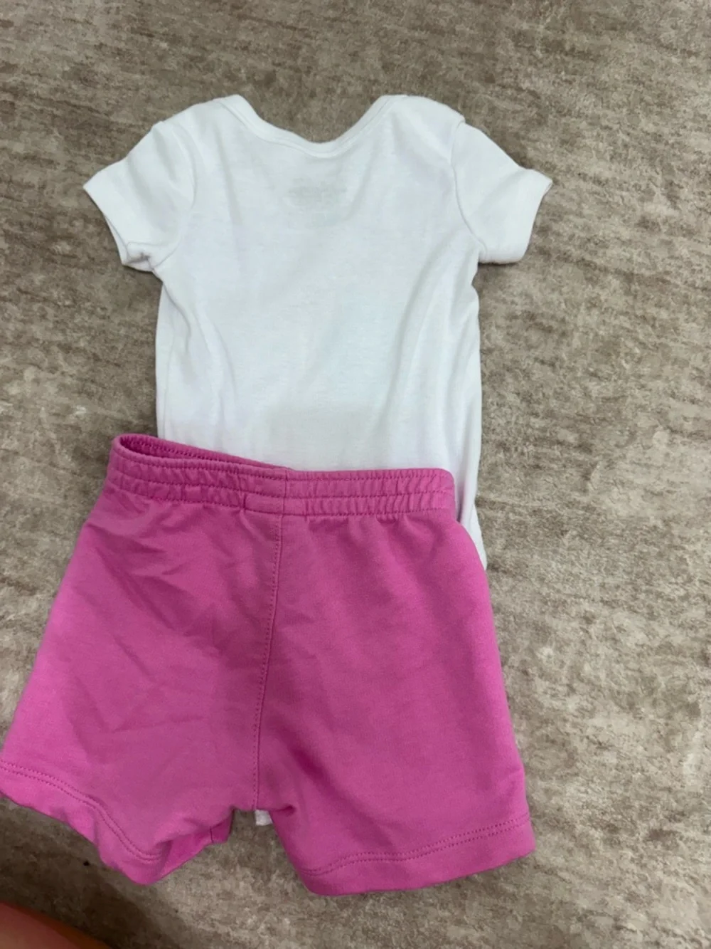 Nike White Baby Bodysuit with Pink Swoosh - Picture 2 of 3